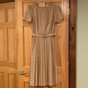 Beautiful lightweight Ann Taylor lined eyelet dress with belt and soft pleats.